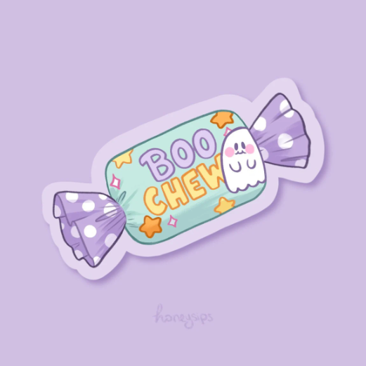 Digital illustration of a pastel purple, teal, and yellow vinyl sticker shaped as a wrapped candy with a cute smiling ghost and the quote "Boo Chew" on the wrapper on a pastel purple background